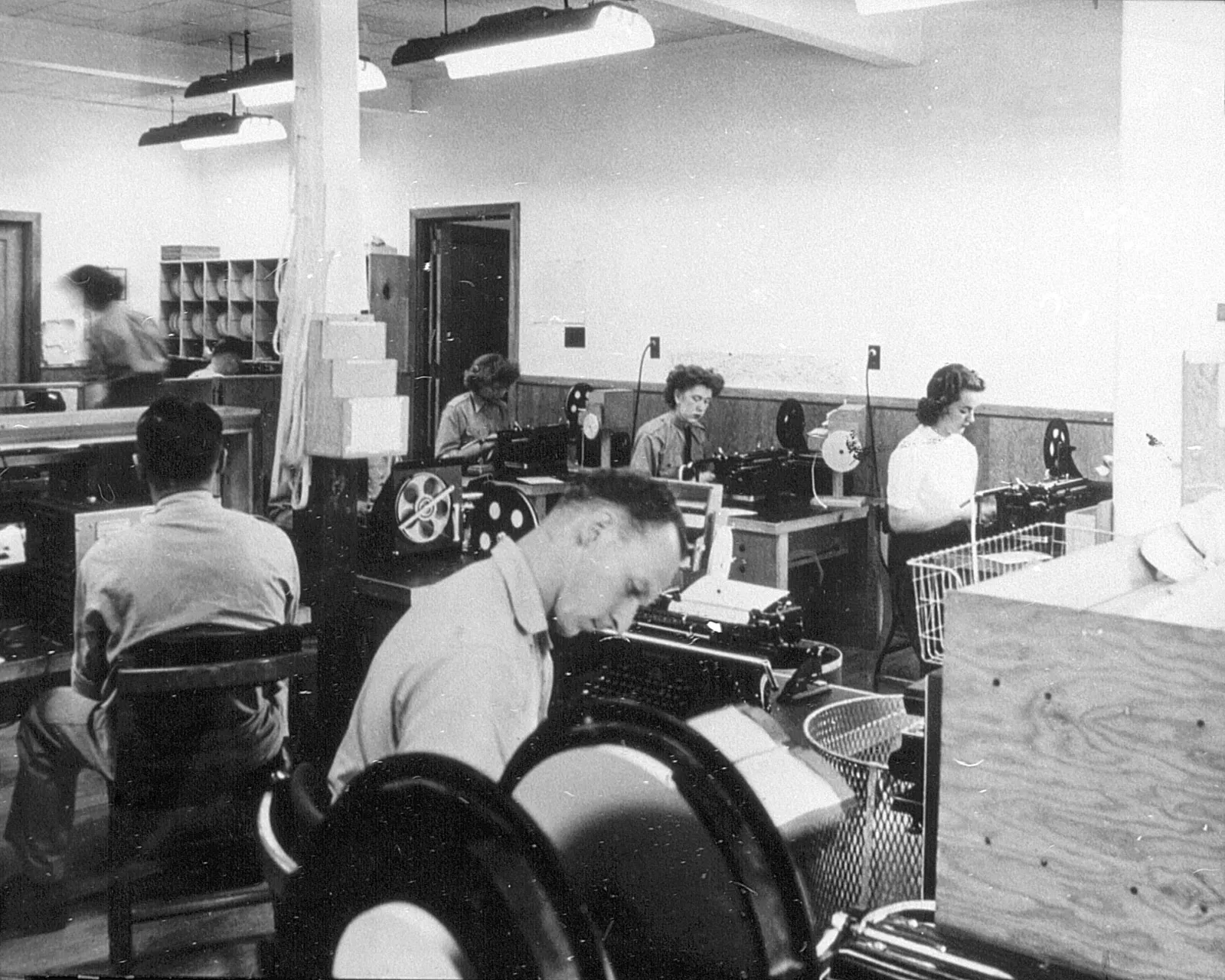 Diverse operating staff perform their duties at Camp X